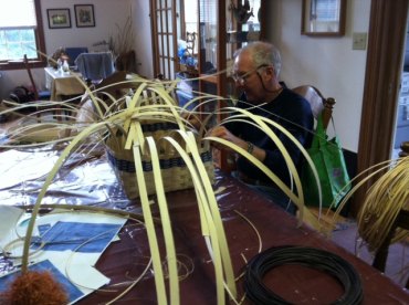 Bill and the beginnings of his too-big-to-steal basket. It will be as tall as the reeds sticking out the top. 